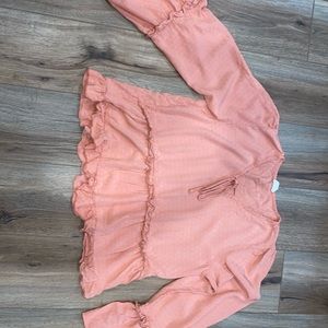 Beautiful coral colored top with flare sleeves